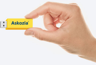 Hand holds the MikoPBX on flash card